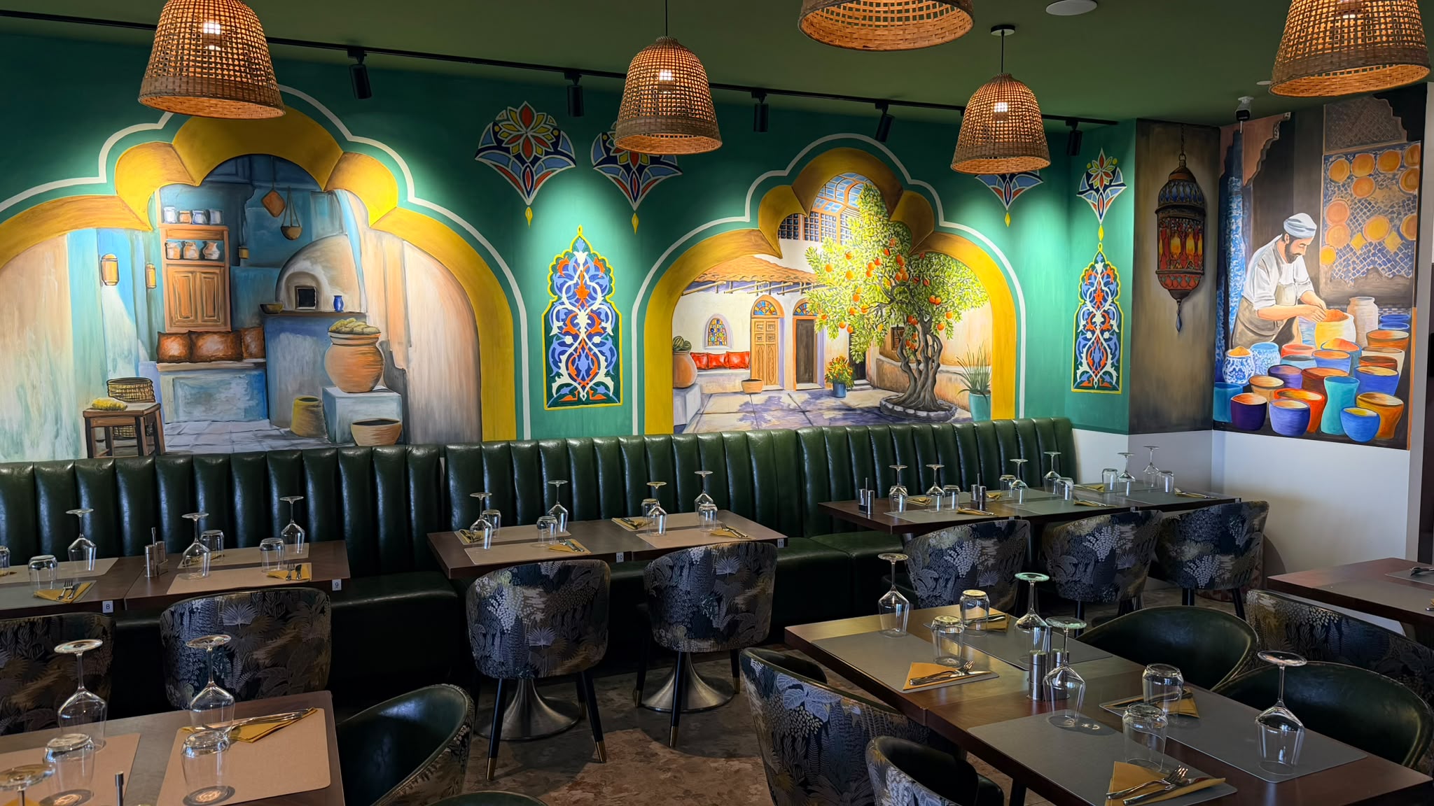 Hand-painted mural of a Levantine souk at Zaytun